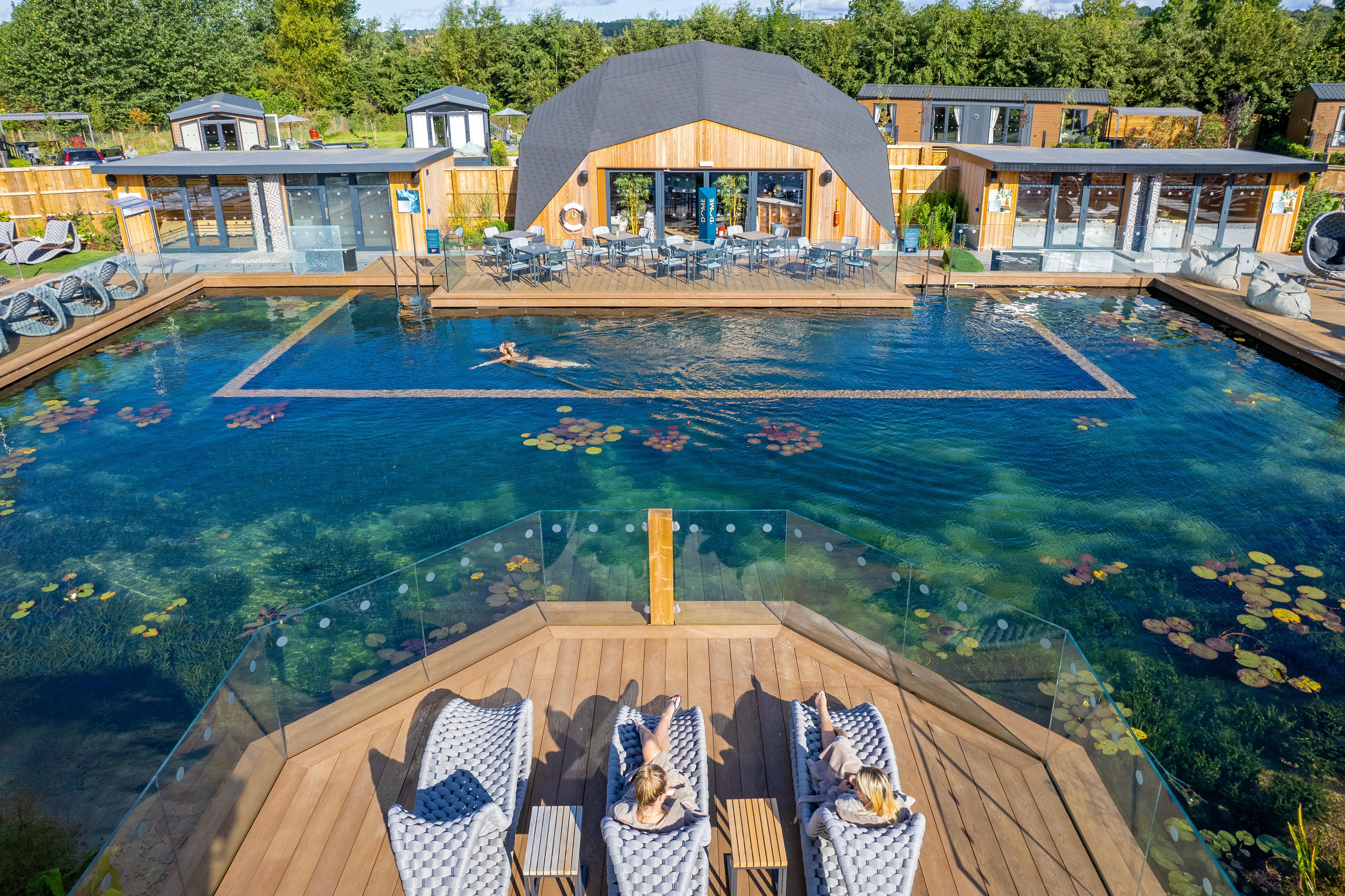 Cordial Luxe sun loungers overlooking the pool at Yorkshire Spa with more cordial furniture in background by Alexander Rose commercial
