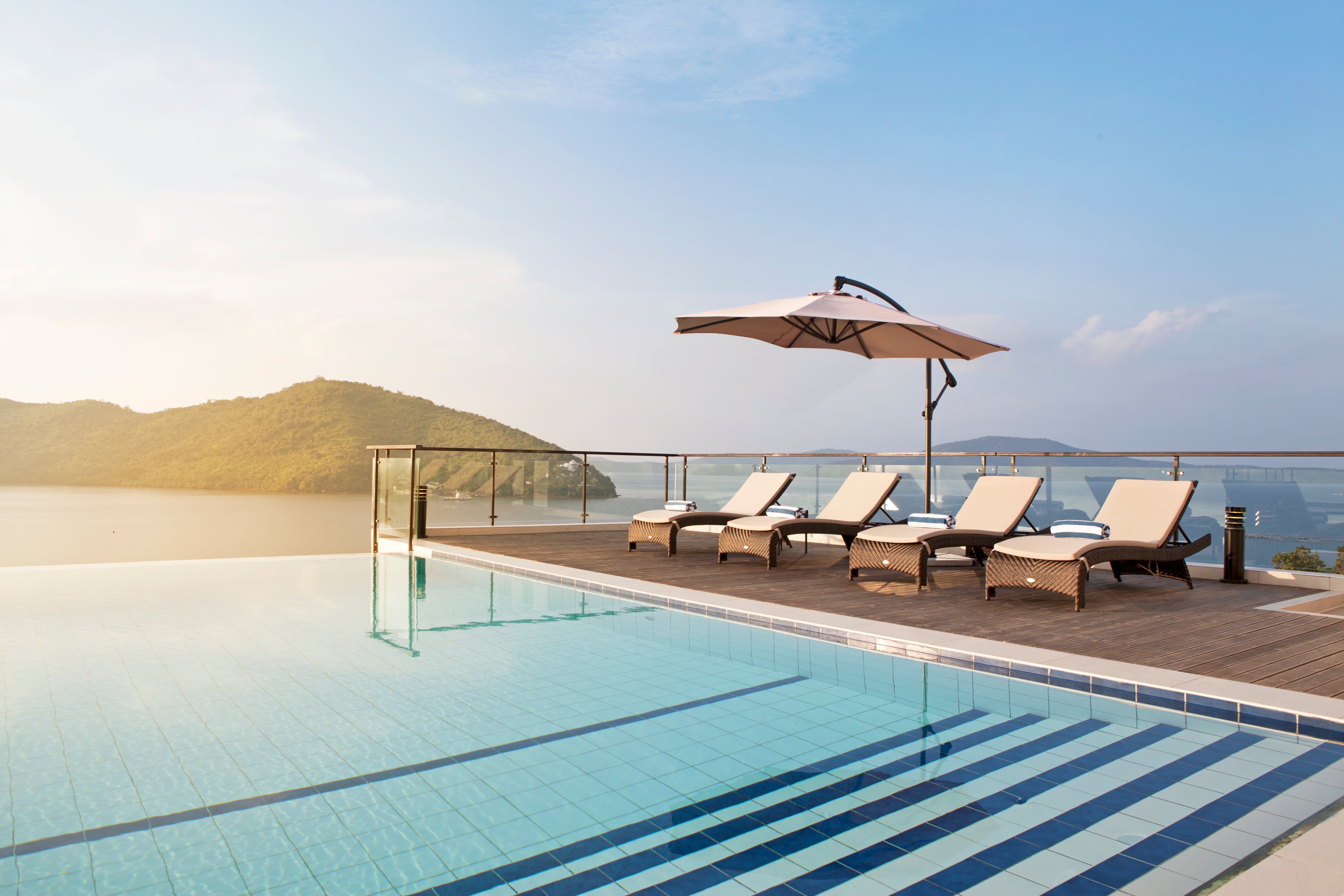 Area Pool Deck Beachbed Umbrella View.jpg